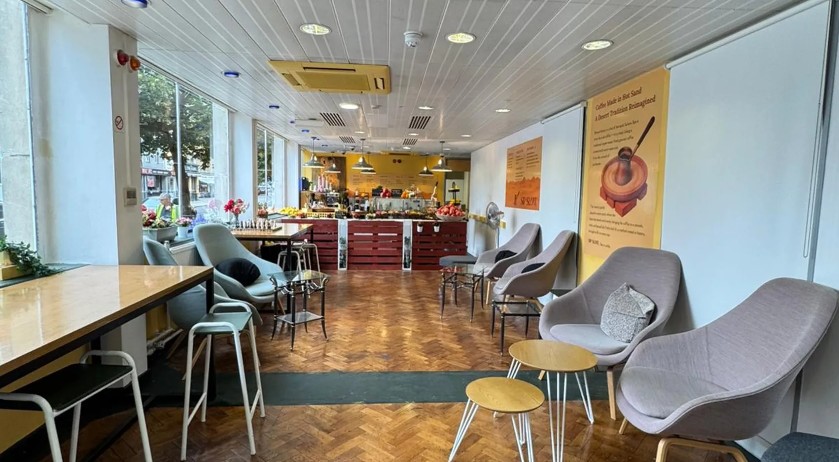 Armchairs and tables inside Sip Slow